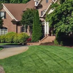 Fresh mower lines and maintained landscaping.