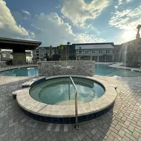 A hot tub in the middle of a pool