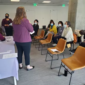 Office Team speaking to Caregivers at Training Event