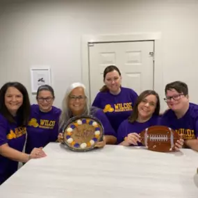 Wearing our purple & gold never gets old! Football season is back, and we are kicking it off with a team tailgate & corn hole fun! ???????? 
#thewilcoxway #nationalteamcolorsday