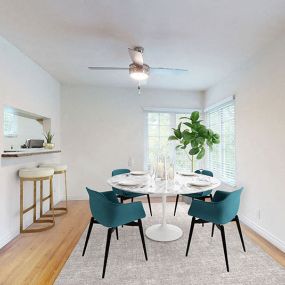 an empty dining room with a table and chairs