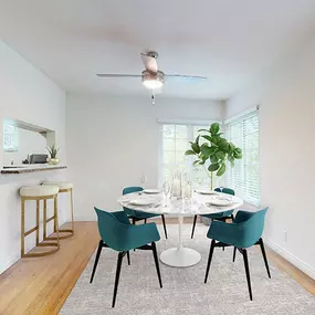 an empty dining room with a table and chairs