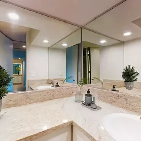 a large bathroom with a sink and a mirror