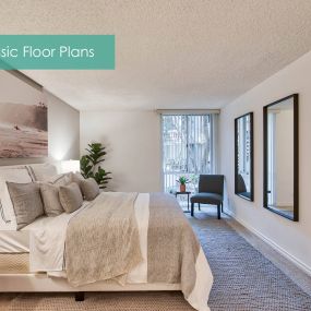 a master bedroom with a large bed and a window