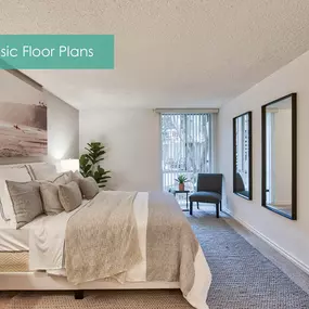 a master bedroom with a large bed and a window