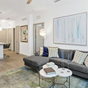 living room and kitchen in an apartment at the 52 Apartment complex in Pensacola, FL