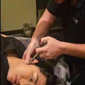 Dr Jay Harrison adjusting TMJ at Lifetime Family Health Center in Grapevine Texas