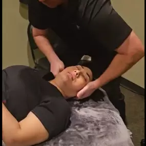 Dr Jay Harrison adjusting neck at Lifetime Family Health Center in Grapevine Texas