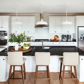 Kitchen boasts a large center island and stainless steel appliances