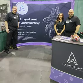 Small Business Expo in Dallas, Texas with the Allegiant Digital Marketing Team posing at tradeshow booth