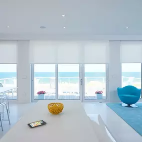 Our translucent Motorized Shades make a perfect choice for these gorgeous sets of  windows as they give absolute privacy but also allow an ample amount of  natural light in. Don’t they just go perfectly in this room of all-white furniture?  #BudgetBlindsKendaleLakes  #MotorizedShades #FreeConsultati