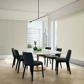 Adding Vertical Blinds by Budget Blinds to your room creates a simple and crisp look. This dining room features a minimalist elegance that works extremely well in modern homes. #BudgetBlindsOfKendaleLakes