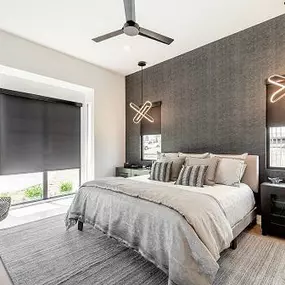 Want to sleep in? Don’t get out of bed to close the Shades! Try our Motorized Roller Shades instead! You can see them here in this perfectly coordinated bedroom!