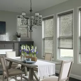 How gorgeous does this dining room look? The custom Wood Blinds add a wonderfully enchanting look to this room! We would love to be invited over for dinner at a place such as this! #BudgetBlindsOfKendaleLakes