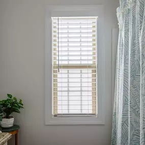 The right Faux Wood Blinds make your bathroom feel so bright, airy, and fresh! Need some inspiration? Check out this bathroom where we installed the perfect Faux Wood Blinds! #BudgetBlindsKendaleLakes #FauxWoodBlinds #MoistureResistantBlinds #FreeConsultation #WindowWednesday