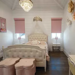 Look at these custom blush pink Norman Roller Shades that make this bedroom look  like a scene straight out of a Disney Film.  #BudgetBlindsKendaleLakes  #RollerShades #NormanShades #FreeConsultation #WindowWednesday