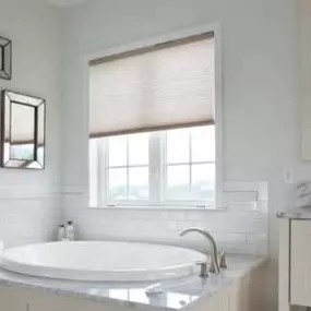 Upgrade your bathroom with the perfect balance of privacy and style with Cellular Shades.