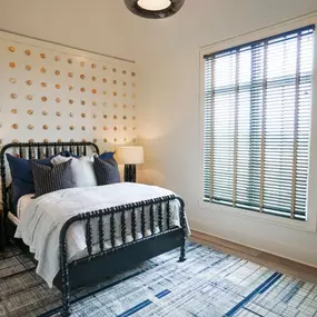 In need of an upgrade for your home? Look no further than Budget Blinds! We have a wide array of styles to fit your needs. Look how these Aluminum Blinds with Decorative Tape upgraded this bedroom instantly!