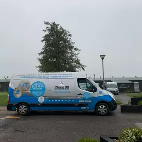 Steaming Sam Carpet Cleaning van outside a job