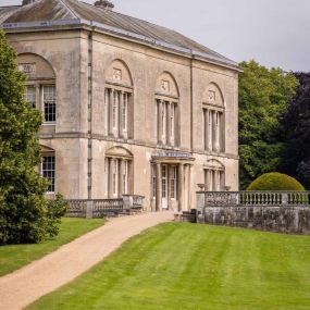 The timeless architecture of Sledmere House shines in this view, showcasing its classical British design and serene surroundings. A perfect snapshot of heritage and grandeur.