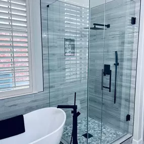 Frameless shower and shower door by Elite Showers