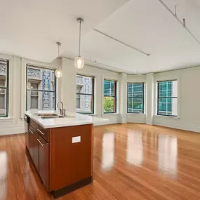 Open living room and kitchen with large windows