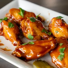 Get ready for a flavor explosion! These sticky, saucy wings from Crazy Wings are packed with bold, delicious goodness.