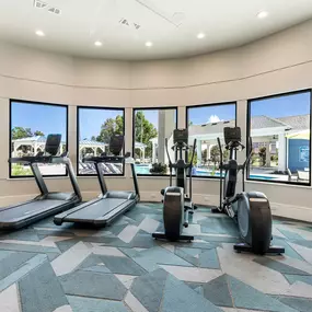 24/7 Fit & Lift Center with a Panoramic View of the Pool Area