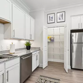 Custom Cabinetry with Under Cabinet Lighting & a Spacious Kitchen Pantry