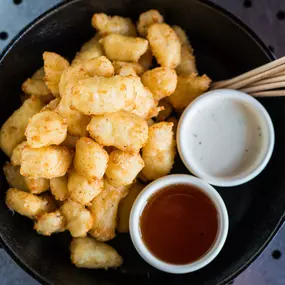 Don’t be shy and give the Wisconsin Fried Cheese Curds a try.