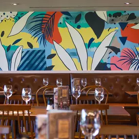Zizzi Cambridge Regent St, lively mural backdrop with stylish seating
