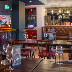 Zizzi Cambridge Regent St, bright dining space with colourful accents.