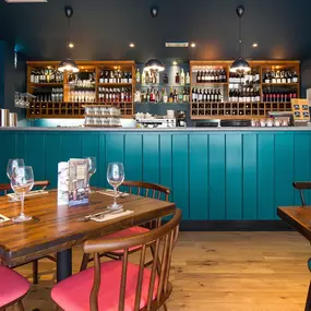 Zizzi Cambridge Regent St, bright dining space with colourful accents.