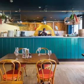 Zizzi Cambridge Regent St, bright dining space with colourful accents.