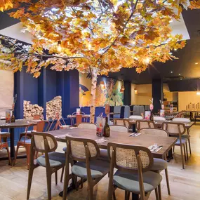 Stylish dining area at Zizzi St Andrews with vibrant colours, modern decor and natural accents.