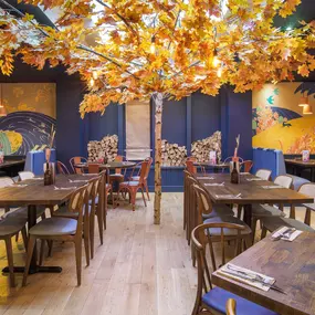 Stylish dining area at Zizzi St Andrews with vibrant colours, modern decor and natural accents.