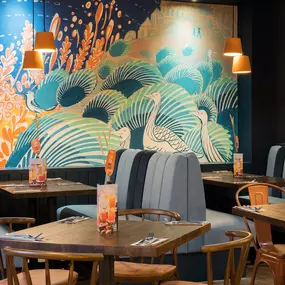 Stylish dining area at Zizzi St Andrews with vibrant colours, modern decor and natural accents.