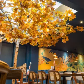 Stylish dining area at Zizzi St Andrews with vibrant colours, modern decor and natural accents.