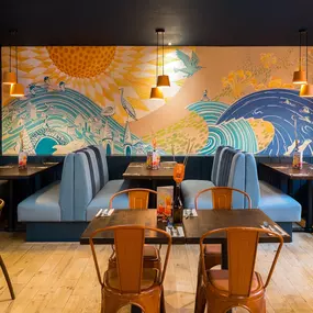 Stylish dining area at Zizzi St Andrews with vibrant colours, modern decor and natural accents.