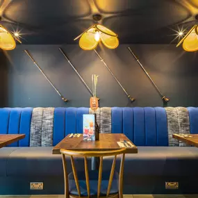 Stylish dining area at Zizzi St Andrews with vibrant colours, modern decor and natural accents.