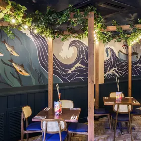 Stylish dining area at Zizzi St Andrews with vibrant colours, modern decor and natural accents.