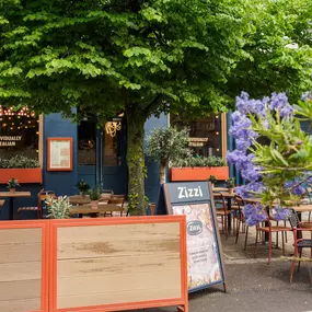 Exterior view of Zizzi St Andrews entrance and outside dining area.