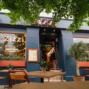 Exterior view of Zizzi St Andrews entrance and outside dining area.