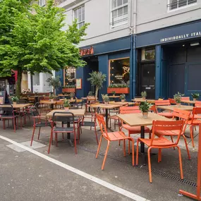 Exterior view of Zizzi St Andrews entrance and outside dining area.
