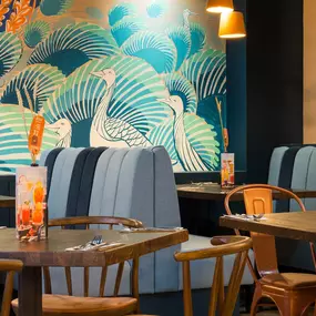 Stylish dining area at Zizzi St Andrews with vibrant colours, modern decor and natural accents.