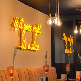 Stylish dining area at Zizzi St Andrews with vibrant colours, modern decor and natural accents.