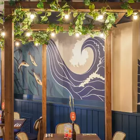 Stylish dining area at Zizzi St Andrews with vibrant colours, modern decor and natural accents.