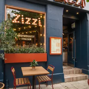 Exterior view of Zizzi St Andrews entrance and outside dining area.