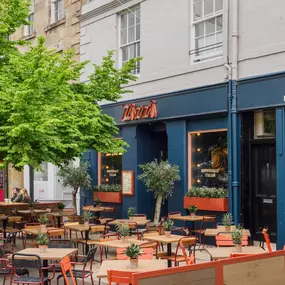 Exterior view of Zizzi St Andrews entrance and outside dining area.
