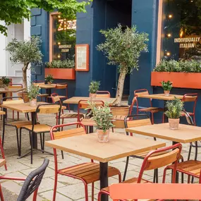 Exterior view of Zizzi St Andrews entrance and outside dining area.